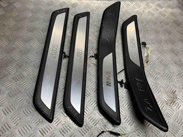 Б/В Накладка порога з підсветкою BMW 7 F01 51477181015 / 51477181013 51477181015 / 51477181013 фото